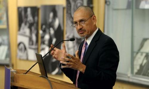 Scientist speaking at a public event